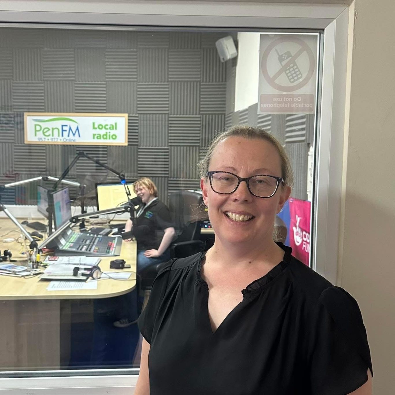 Rebecca outside a Radio studio after an interview.