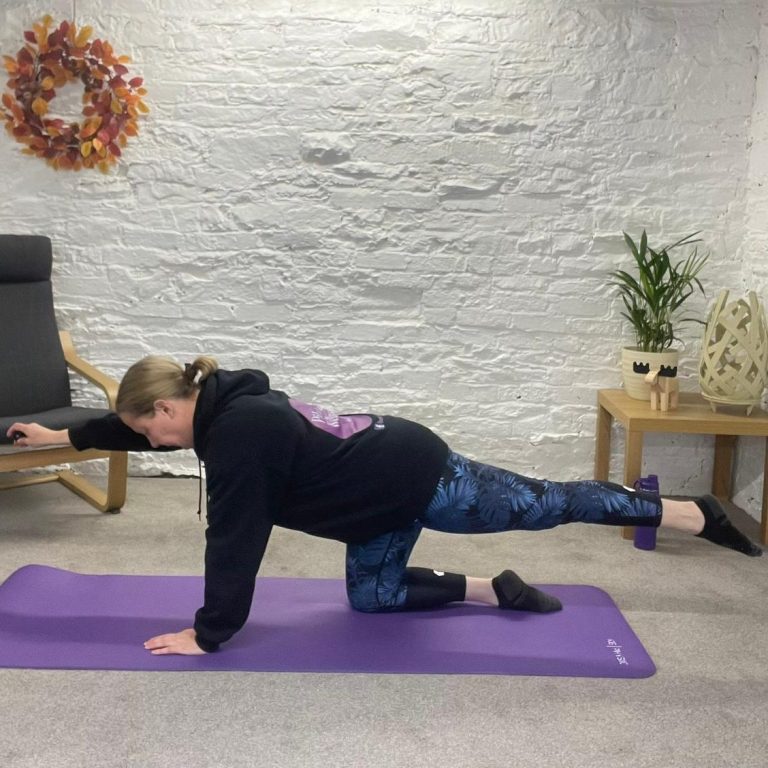 Rebecca from Pilates and Wellness by Rebecca Anne in her virtual studio The Wellness Barn where she runs her virtual Pilates classes.